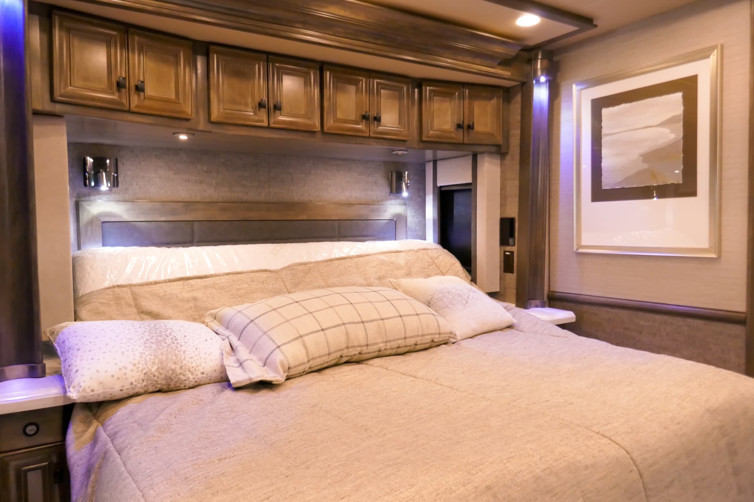 Master suite of a luxury Class A motorhome, bright even light